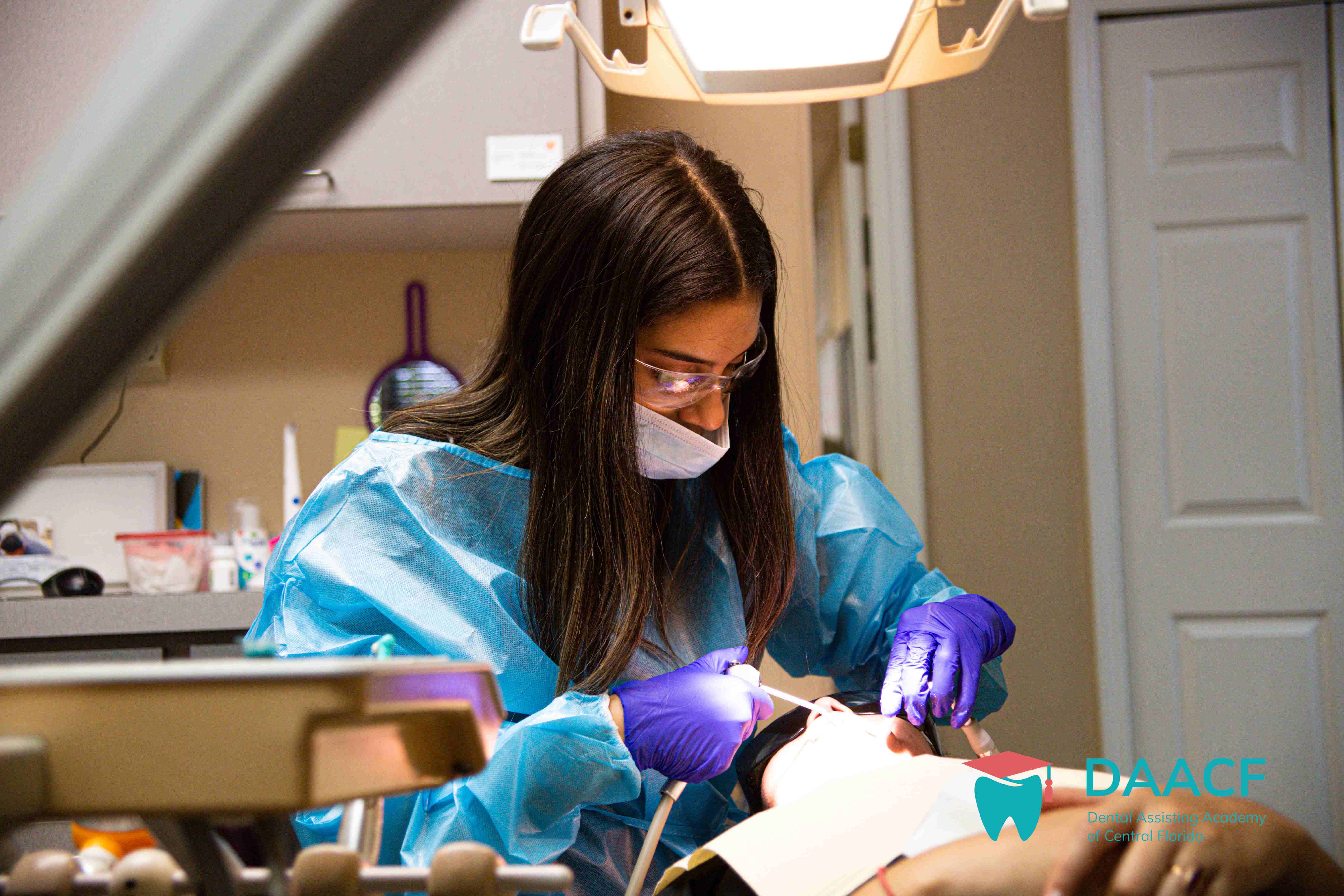 Dental Assisting student performing a procedure at DAACF